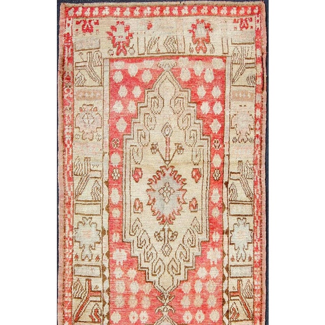 Tribal Vintage Turkish Oushak Runner With Soft Red Field and Pale Ivory Medallions For Sale - Image 3 of 6