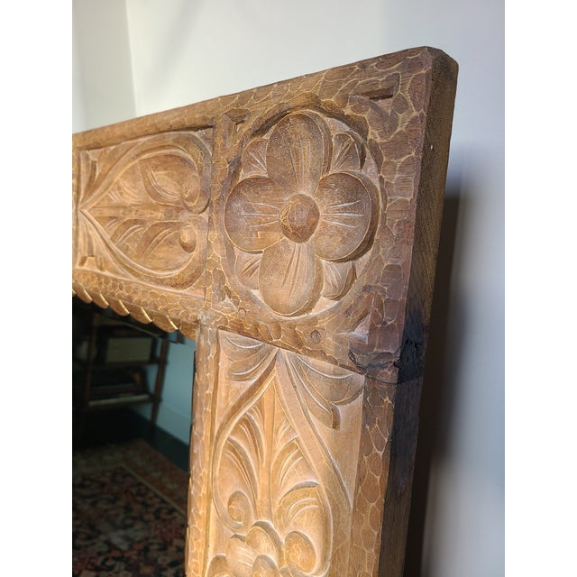 Exceptional hand-carved Indonesian style mirror by Dauphine Harrison & Gil. Crafted from teak. Features lovely lotus...