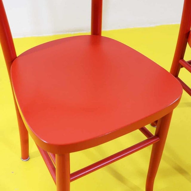 Classic robust vintage red wooden chairs - pair.