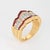 Stylish diamond & ruby band crafted in 18 karat yellow gold (circa 1980s). Calibre cut rubies measure approx. 1.5mm each....