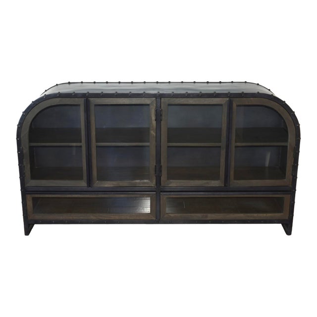 Beautiful industrial display cabinet with riveted steel construction, curved aircraft-inspired sides, tempered glass...