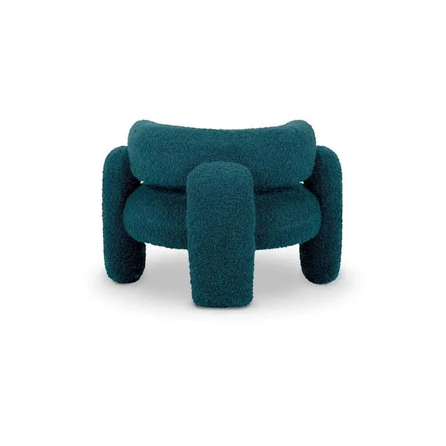 Embrace Cormo Azure Armchair by Royal Stranger Dimensions: W 96 x D 85 x H 68 cm. Materials: Upholstery. Featuring an...