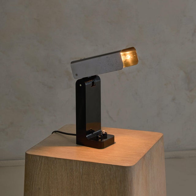 A rare 'Vademecum' table lamp designed by Joe Colombo for Kartell in 1969. Compact in scale, the lamp is crafted from...