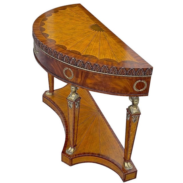 Large demi-lune vintage Empire style inlaid wood console table with brass and wood caryatid legs and inlaid wood starburst...