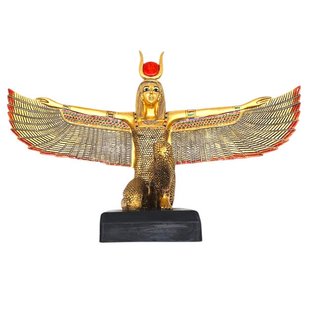 A deity in gold, arms outstretched like the horizon at dawn. This commanding figure of Isis kneels in solemn grace, her...
