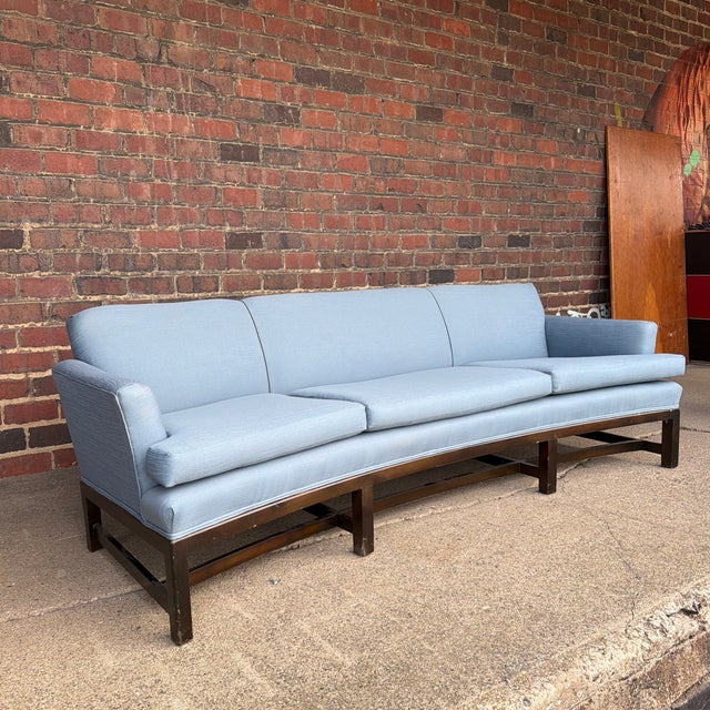 An elegant Mid-Century Modern curved front sofa attributed to Edward Wormley for Dunbar. While we have not been able to...
