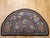 This charming vintage American hand-hooked rug, created in the early 1900s in the New England region, is a beautifully...