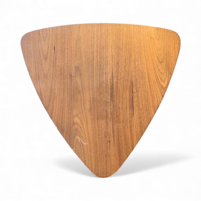 An authentic Jens Risom teak side table in the highly collectible “guitar pick” triangular form, a true Mid-Century Modern...