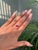 This bypass ring features a 1.25 carat emerald-cut ruby, set in 14K yellow gold. The vibrant ruby measuring 7 x 5 mm. The...