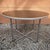 Art deco coffee table with bauhaus modernist accents, reminiscent of the work of marcel breuer. This round table with its...