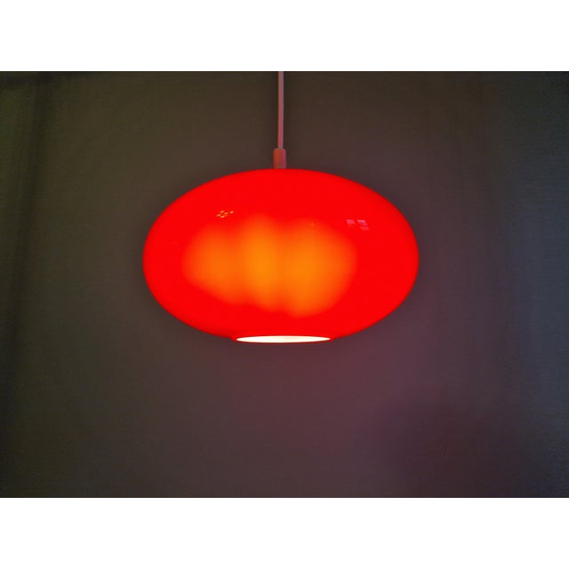Vintage red opaline glass pendant light from the 1960s-70s. Rewired and compatible with an E27 LED bulb. Globe dimensions:...