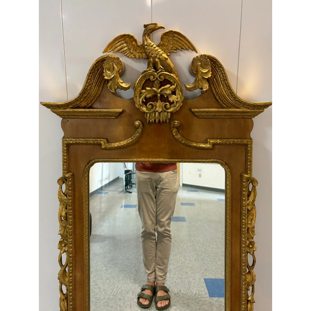 A striking George II style parcel gilt mirror with fabulous carvings! Broken, swans neck pediment crowned with a carved ho...