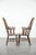 Offered for sale is this set of two antique English high-back Windsor chairs from the 18th century with a beautiful color...