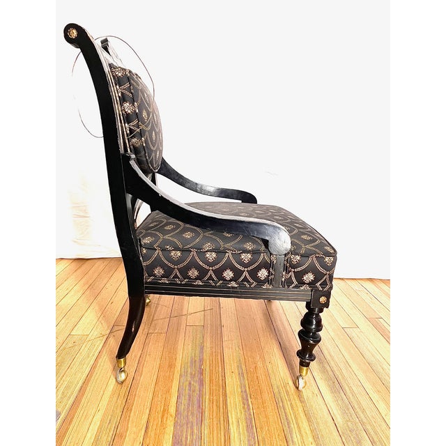 A true original antique chair featuring square mother of pearl inlay set within an ebony black wood frame. The piece is...