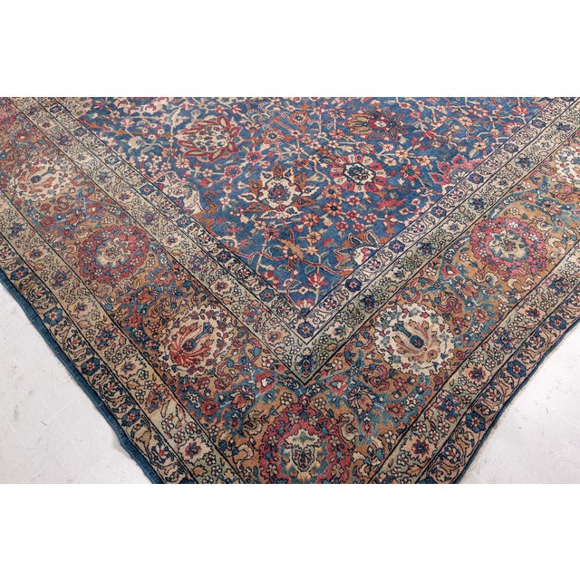 One of DLBs exceptional early 20th century antique Persian Kirman hand-knotted wool rug. Its oriental design is having a...