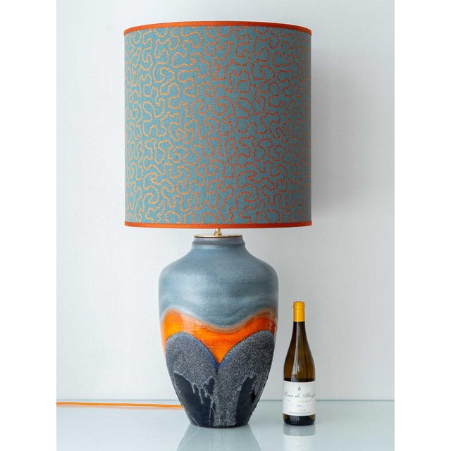 1960s Carstens Tönnieshof West German fat lava ceramic table lamp, 38-inch tall in gray and orange with custom jacquard...