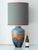 1960s Carstens Tönnieshof West German fat lava ceramic table lamp, 38-inch tall in gray and orange with custom jacquard...