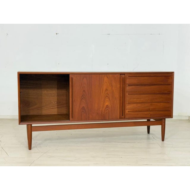 For sale is a beautiful HP Teak Hansen sideboard from the 1960s, in excellent, well-maintained condition. This exclusive...