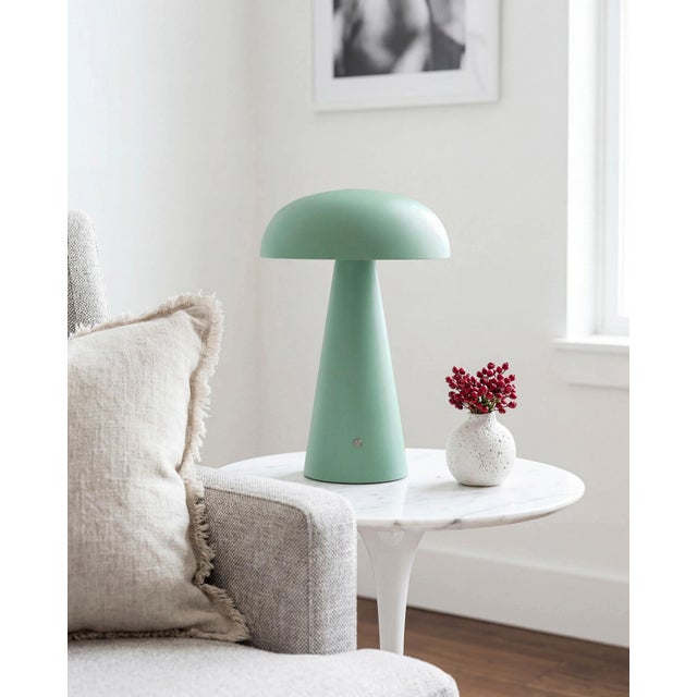Illuminate your space with the chic and portable Umbra accent table lamp, a beacon of minimalist modern style. Standing at...