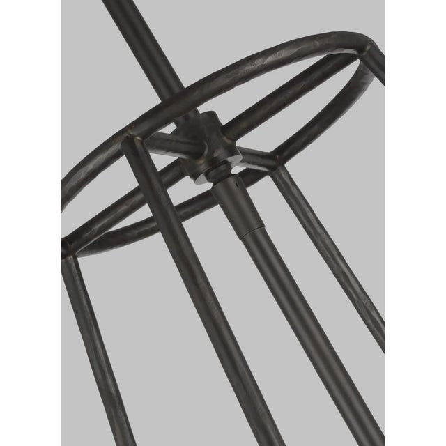 The Atlas one light indoor pendant in aged iron exudes touches of mid-century modern style with rustic undertones. A hand-...