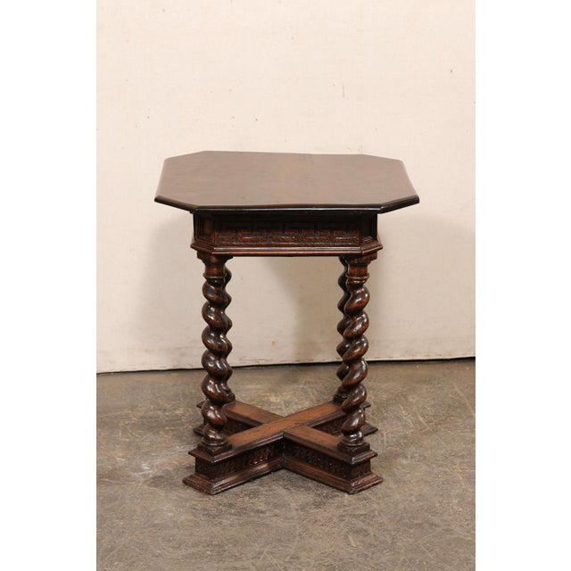 An elaborately-carved Italian side table with small drawer, from the 18th century. This wonderful little table from Italy...