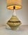 Beautiful Mid-Century Modern table lamp crafted in textured ceramic with distinctive hand-cut geometric openings. Its...