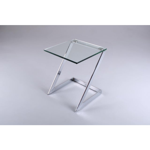 Cutting edge chrome plated iron side table in Bauhaus tradition but with postmodern hallmarks. Made by Gebra Germany in...