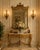 This elegant Chinoiserie-style pagoda mirror dates to the mid-20th century, circa 1950–1960. The frame is primarily...