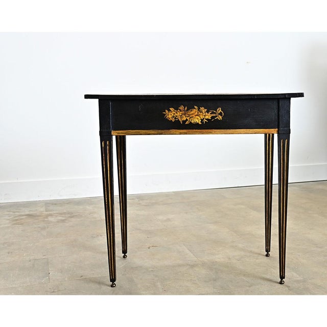 A wooden English console or end table has been recently updated with new paint of ebonized effect and pasted découpage...