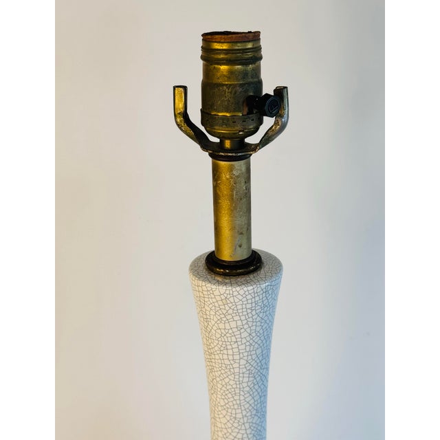 Vintage 1960s Faux Crackle Style Tall Table Lamp. The lamp has a brass base and the background of the crackle is white. No...