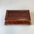 A stunning vintage Maitland Smith (tagged) box, with a mahogany parquet veneer, brass corner and trim details and leather...