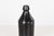 Antique 19th century American stoneware bottle in a rich manganese or Albany slip glaze, with a classic cylindrical form,...
