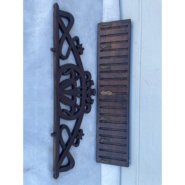 An original antique wall coat rack from the late 19th or early 20th century, made of solid wood. Beautiful decorative...