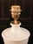 An elegant white ceramic table lamp, crafted in Manises, near Valencia, a town with a long ceramic tradition. Its classic...