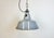 Industrial grey enamel factory pendant light made in Netherlands during the 1960s. White enamel inside the shade. Cast...