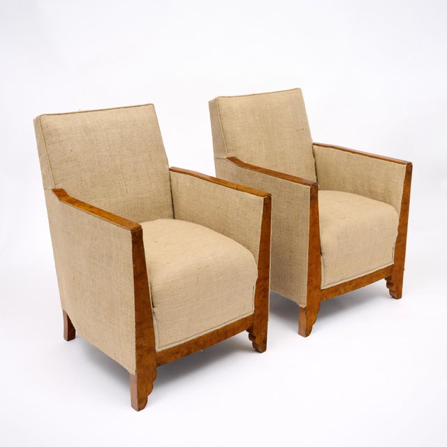 French bergères from the Art Deco period. These chairs are crafted with polished burled ash armrests and wood structures...