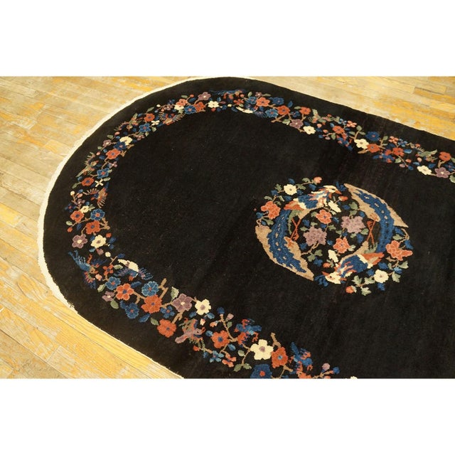 Antique Art Deco Small Oval Wool Black Rug, Circa Date: 1920s. This exceptional piece captures the transitional design...