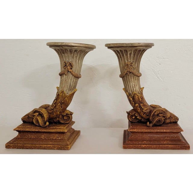This is a good looking pair of Italian neo-classical style candlesticks. They have an elongated cornucopia that graduates...