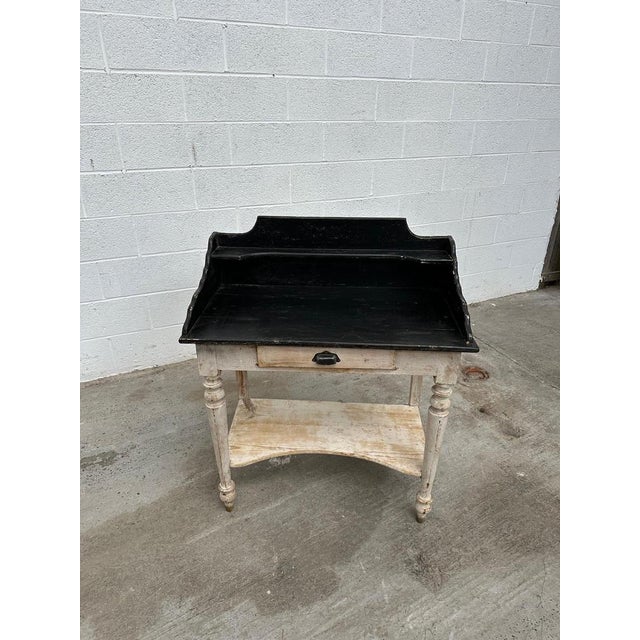 Pretty little patinated dressing table dating from the early 20th century. It has a functional drawer and a low shelf. I...