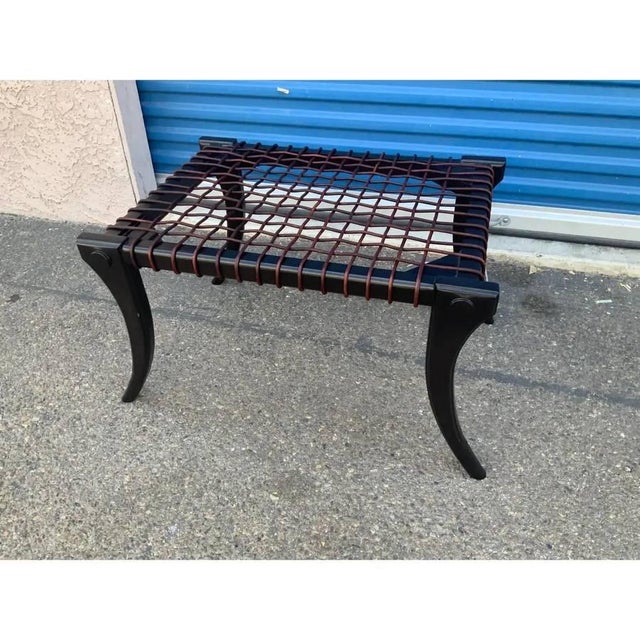 Robsjohn Gibbings style ottoman. The ottoman is in good condition. The wood has a soho /dark chocolate almost black stain....