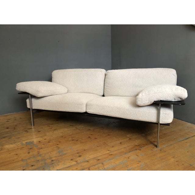 Diesis sofa, by b&b italia. the two -seater sofa is a product of the b&b italia of the seventies. the structure in black...