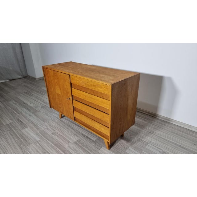 Sideboard by Jiri Jiroutek for Interier Praha, 1960s, in Worn conditions. Designed 1960 to 1969 This piece has an...