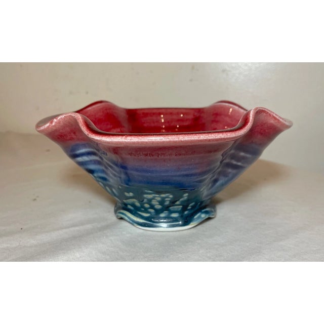 Discover the unique charm of a Vintage James Sankowski Ballston Lake Pottery Ceramic Glazed Footed Red Bowl, a piece that...