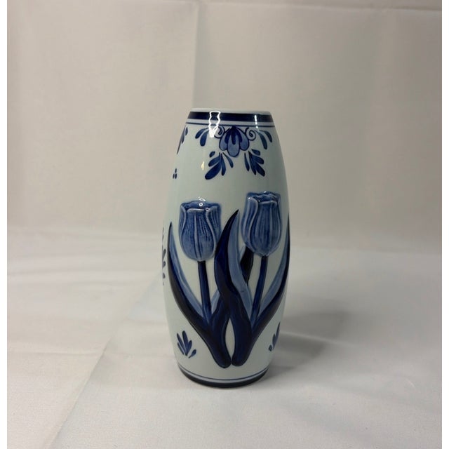 Bring a touch of classic Dutch charm to your home with this beautiful Bosman Holland Delft Blue ceramic vase. Expertly...