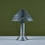 Postmodern table lamp by Los Angeles lighting designer Ron Rezek, c.1980s. The lamp features a galvanized steel frame and...
