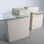 Amazing pair of post modern textured plaster and cantilevered glass side tables. Wonderful vintage condition. 27”W x 24”D...
