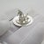 This vintage silver miniature depicts a traditional dutch man standing beside his dog, crafted as a desktop display...