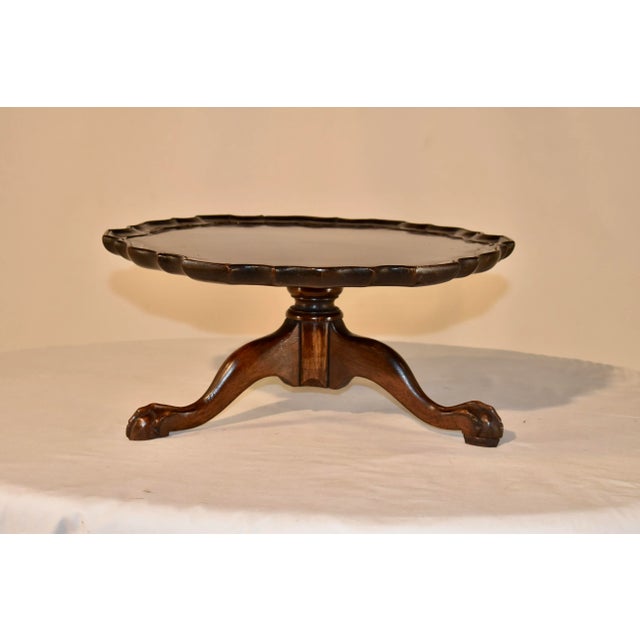 Circa 1900 mahogany lazy Susan from England. The top has a molded pie crust edge, following down to a lovely hand turned...