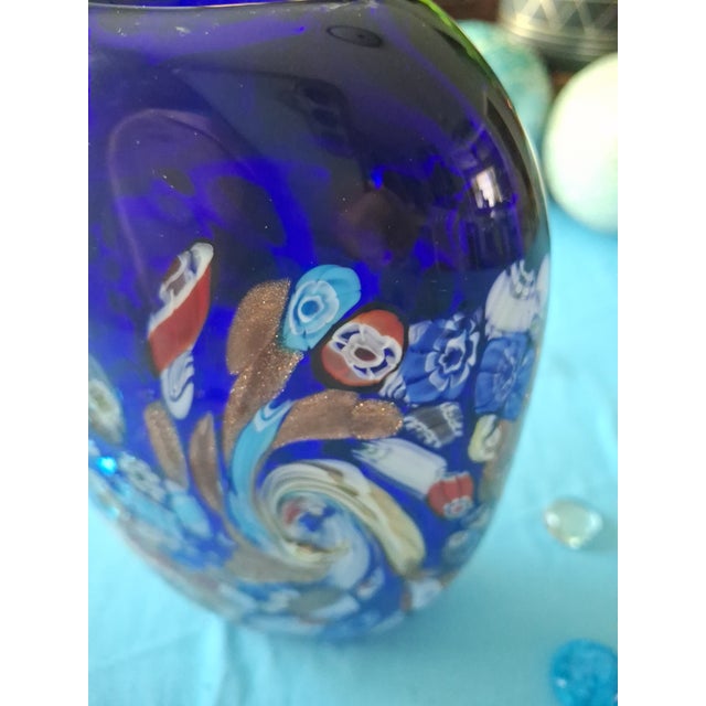 Technique: It uses the iconic Millefiori (thousand flowers) method, featuring fused multicolored glass canes (murrine) set...
