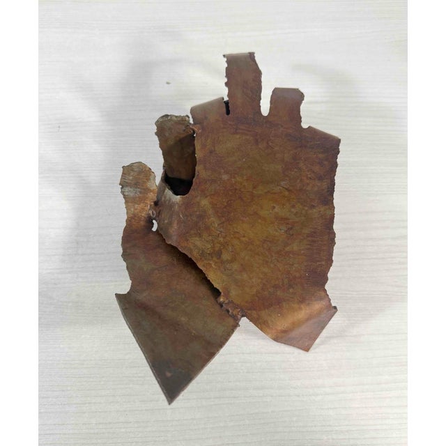 Abstract bronze sculpture titled "Clasped Hands" by Herbert Simon. Created in 1998. This bronze work explores gesture and...
